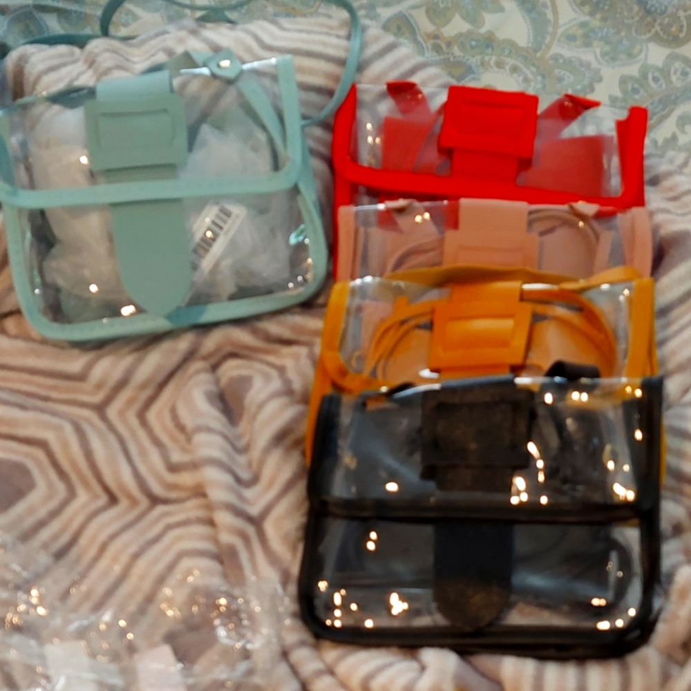 Selling these gorgous  plastic see throw purses .